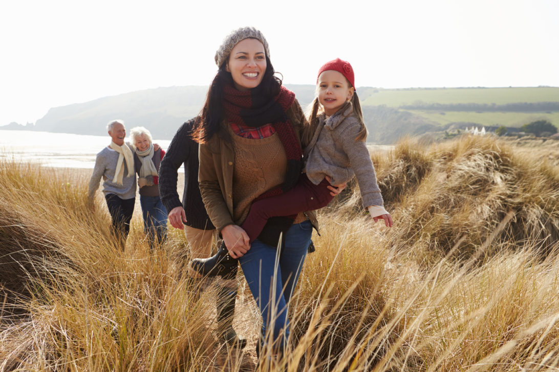 Family walking on Freshwater East Beach