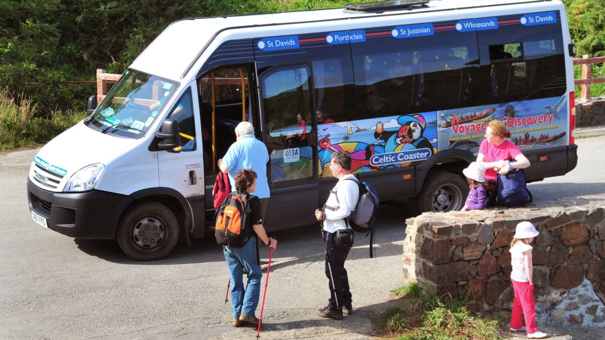 Minibus picking up passengers