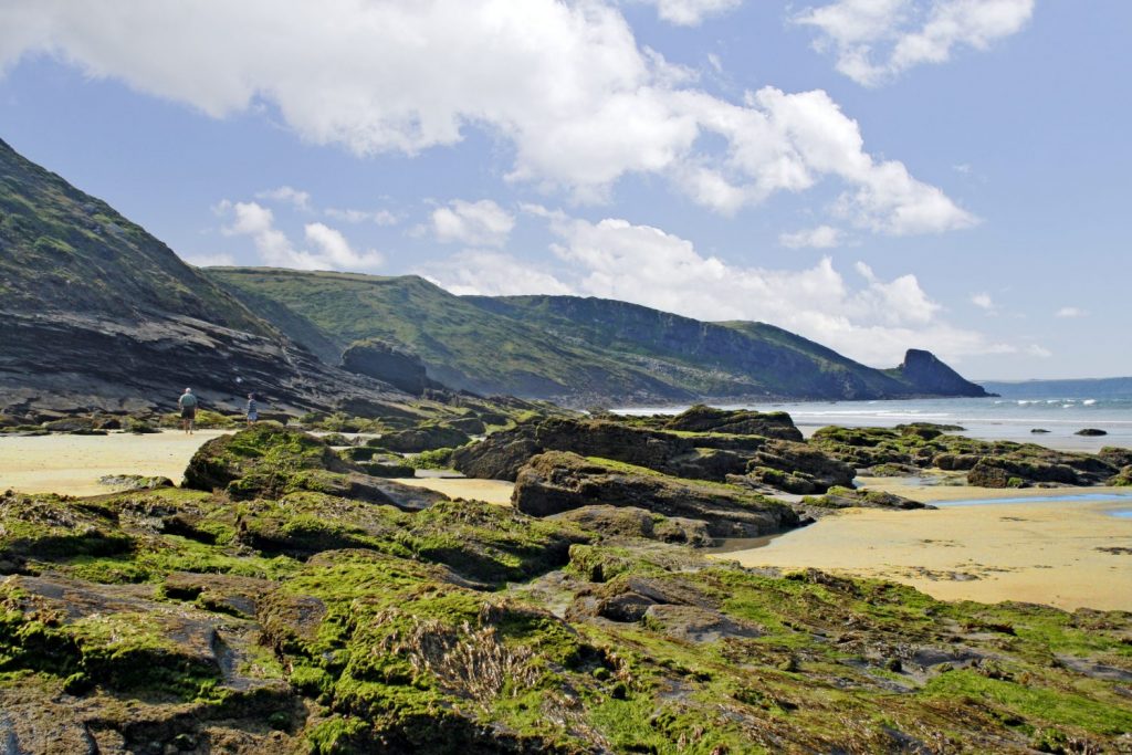 Rockpools at Newgale beach with Rickets Head in the background