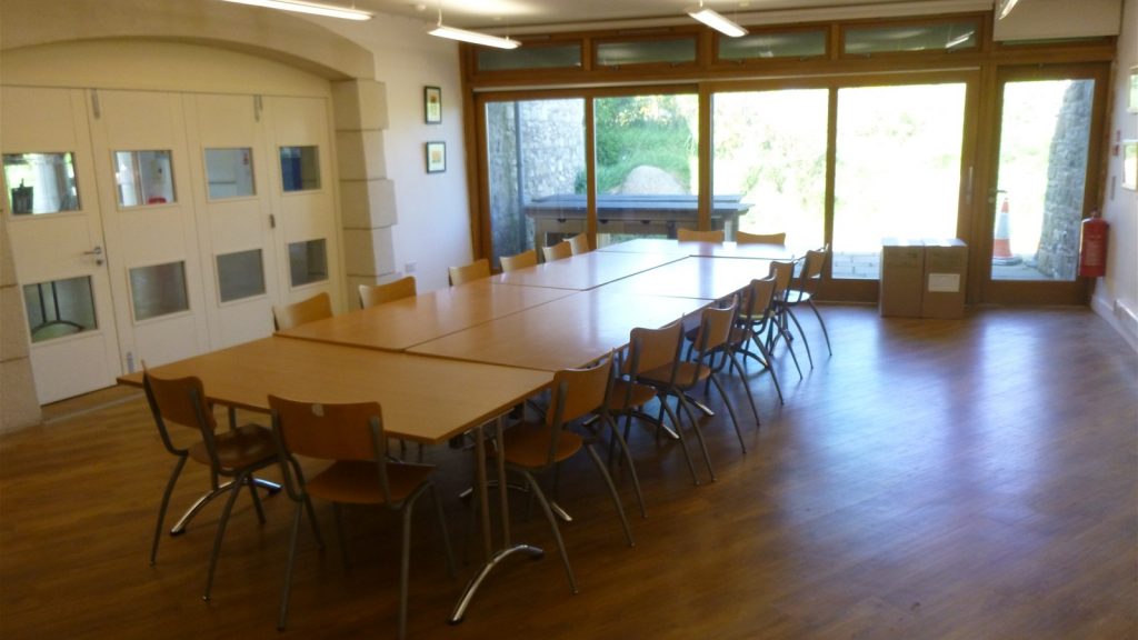 Tables and chairs in the St Davids Room, Oriel y Parc