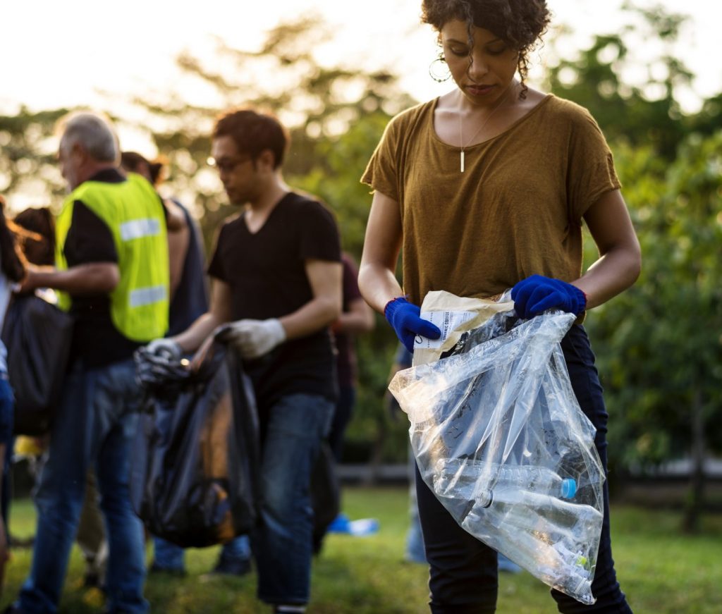 Group of people picking up litter