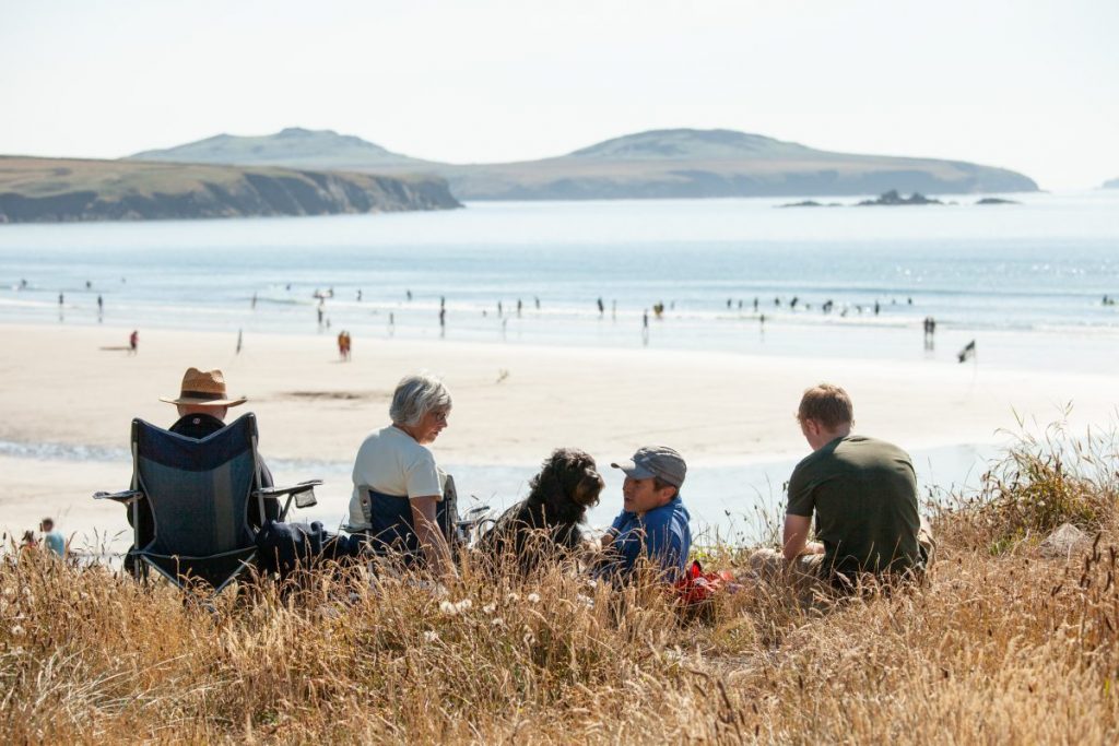 Family at Whitesands Bay near St Davids, Pembrokeshire, Wales, UK.