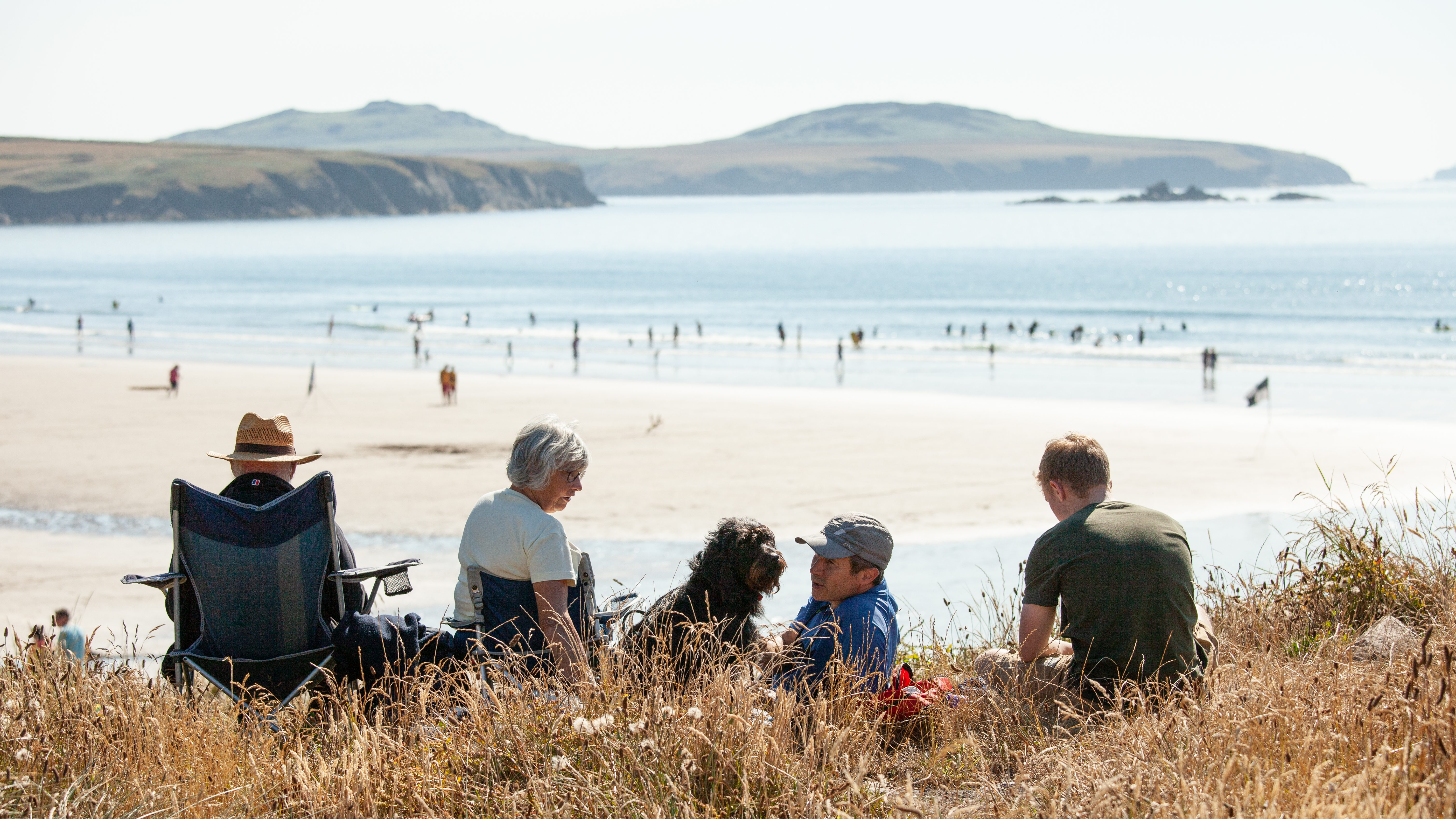 Family at Whitesands Bay, St Davids, Pembrokeshire Coast National Park, Wales, UK