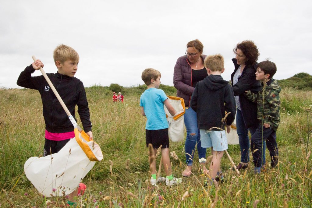 Pupils learning outdoors with teachers