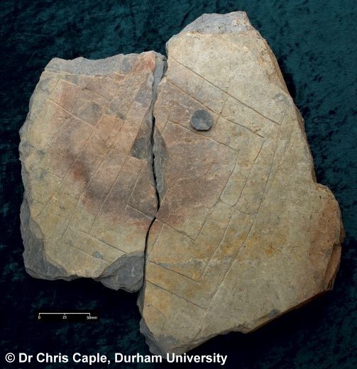 Scratches on a broken stone (Archaeological dig find