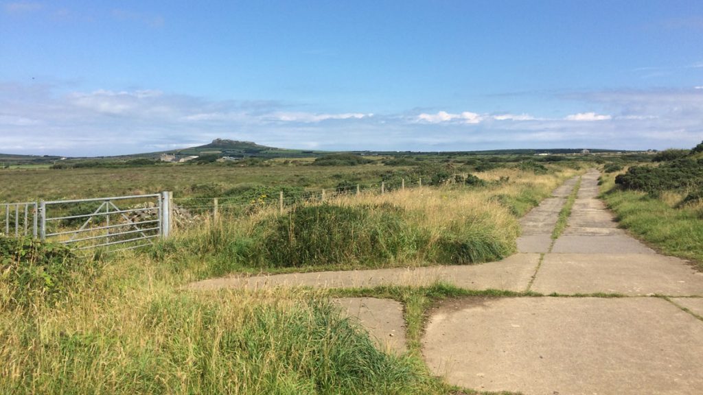 Concrete paths with grassy verge alongside (location pictured is St Davids Airfield)