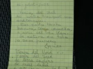 Poem written in Catalan in a notepad. The poem is signed 'Ama'