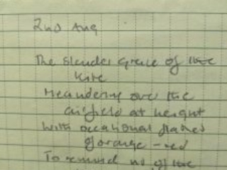Poem written in a notepad. It reads: 2 Aug. The slender grace of the kite Meandering over the airfield at height With occasional flashes of orange-red To remind us of the servicemen, long dead