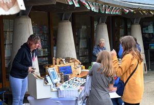 Stalls selling goods at an outdoor craft market at Oriel y Parc