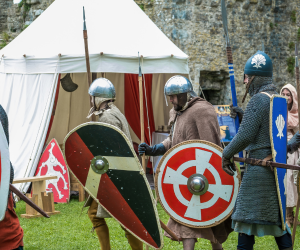 Costumed warriors with swords and helmets